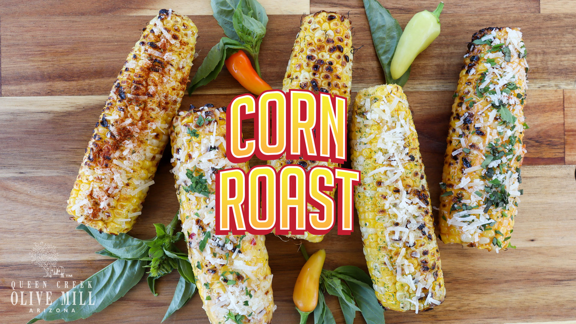 Corn Roast text header with four pieces of roasted corn on a cutting board.